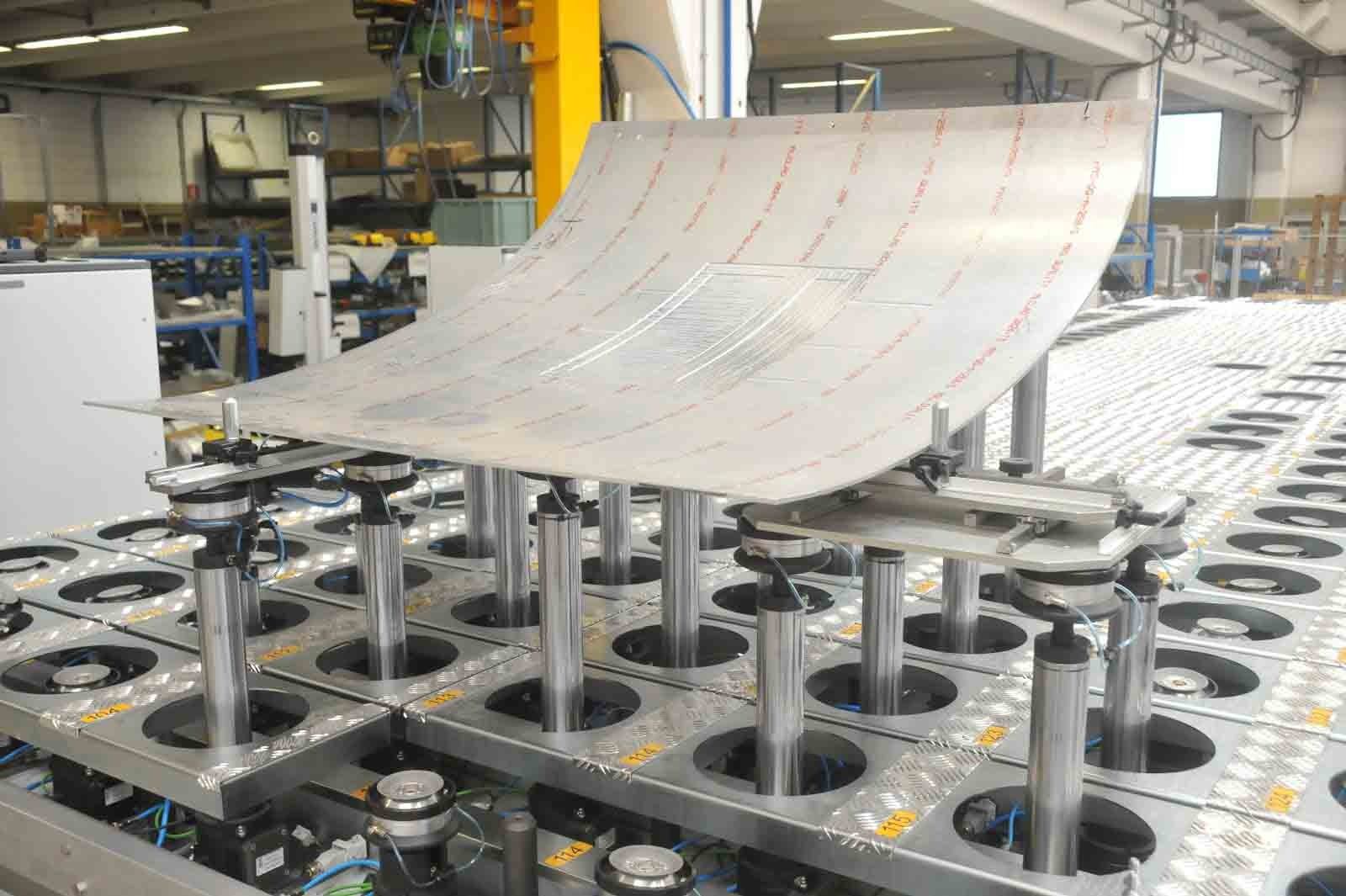 5-axis machining of a large curved aircraft composite panel on a CMS machining center