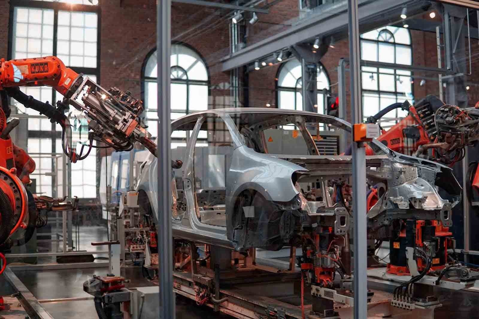 Robots assembling a car body on a production line
