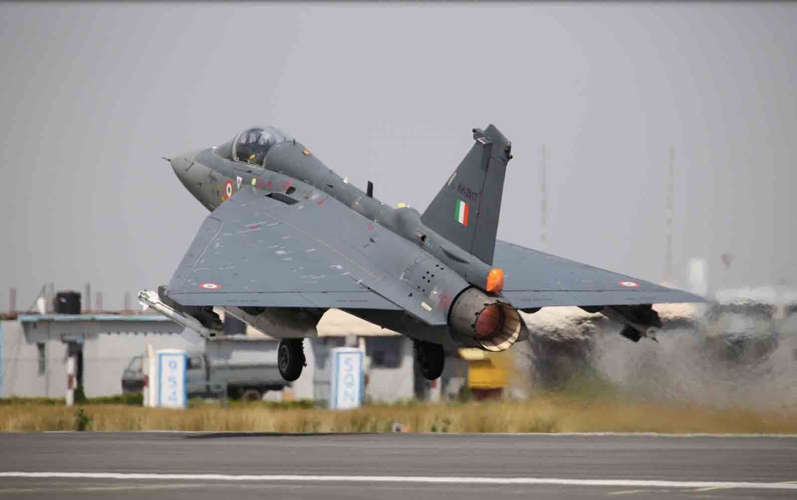 Fighter jet taking off from a runway